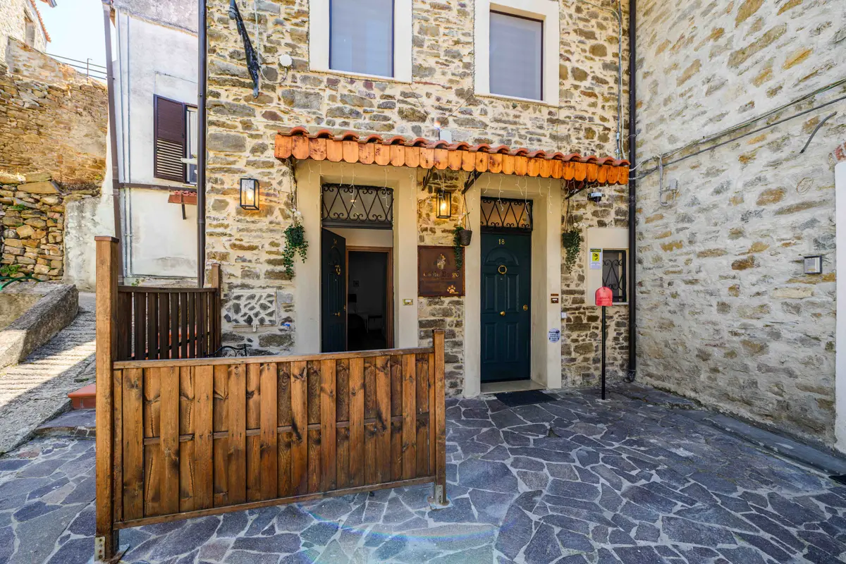 The stone façade of Ca' del Borgo in the village of Ogliastro Cilento