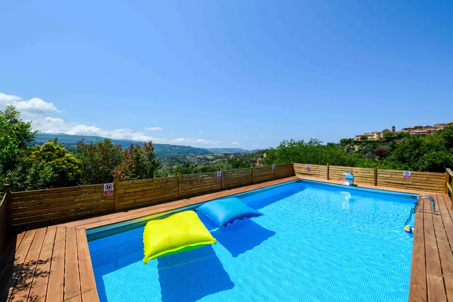 The pool at Ca' del Borgo with a view of the Cilento hills