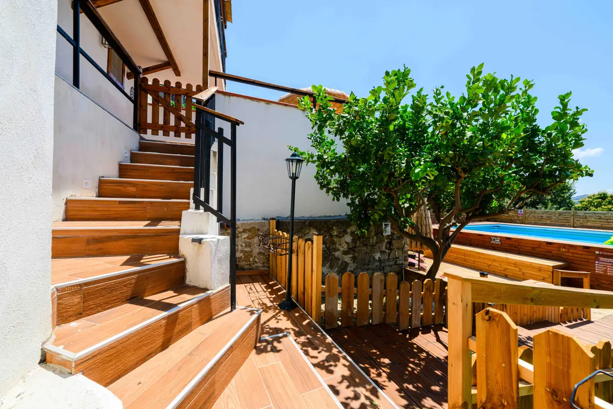 A path through the citrus garden towards the pool