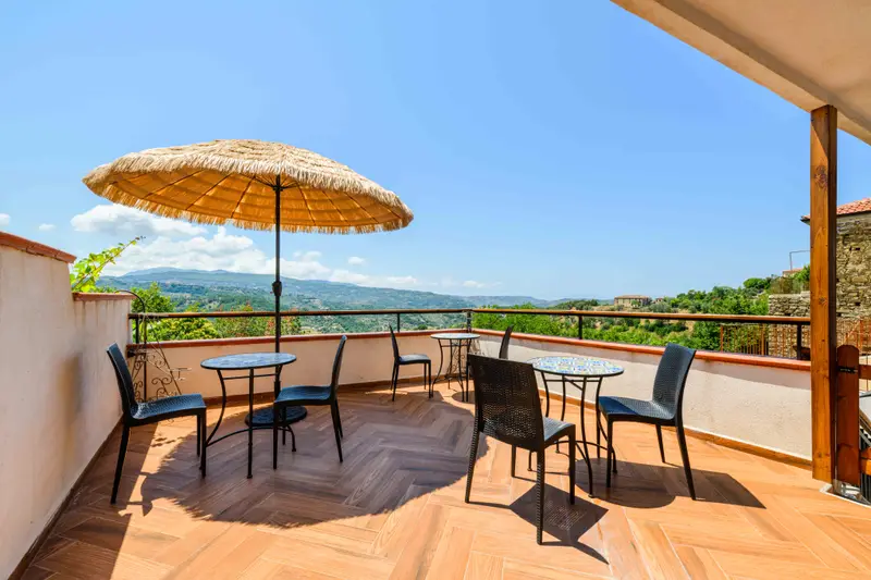Panoramic terrace with a straw parasol