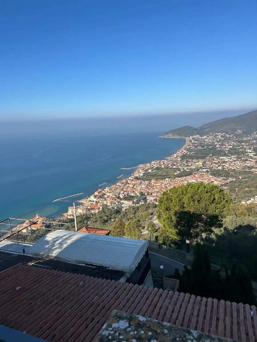 The rooftops of the old village of Castellabate and, below, the coast of Santa Maria